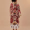 back view of model wearing fleece midi length coat with red and gold abstract floral print