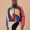 model wearing reversible puffer jacket with colorful toucan face