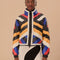 model wearing reversible puffer jacket with colorful geometric stripes