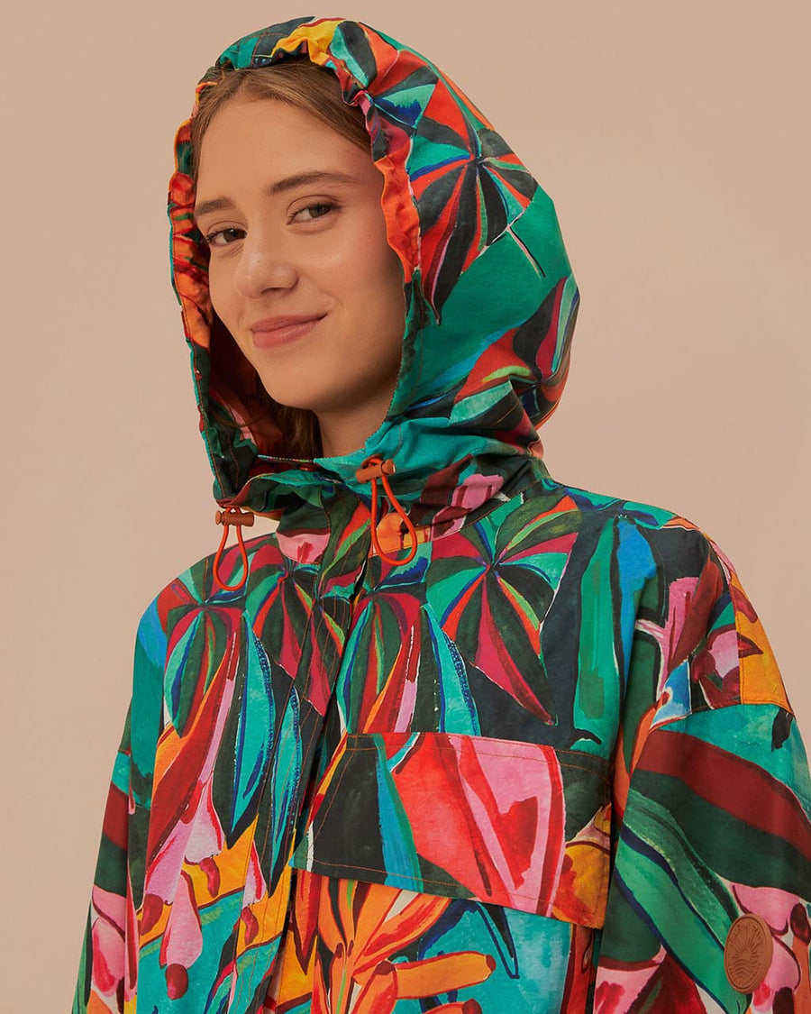 model wearing hood of colorful long raincoat