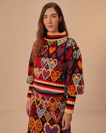 model black sweater with colorful abstract hearts and striped mock neck, sleeve cuffs and hem