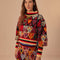 model black sweater with colorful abstract hearts and striped mock neck, sleeve cuffs and hem