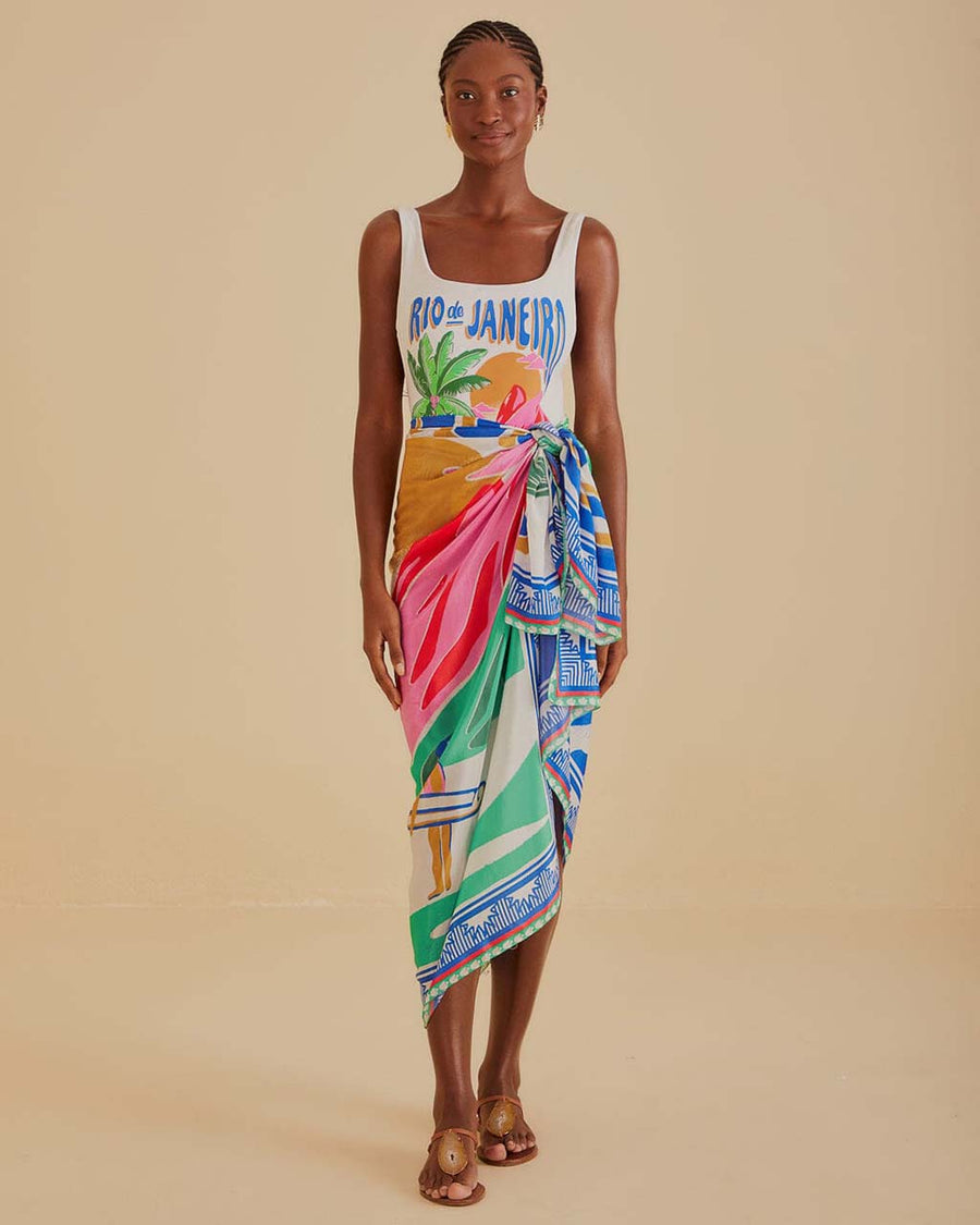 model wearing cream sarong with colorful vintage beach poster print