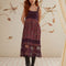 model wearing purple midi dress with crochet bodice and floral skirt with lace and crochet details