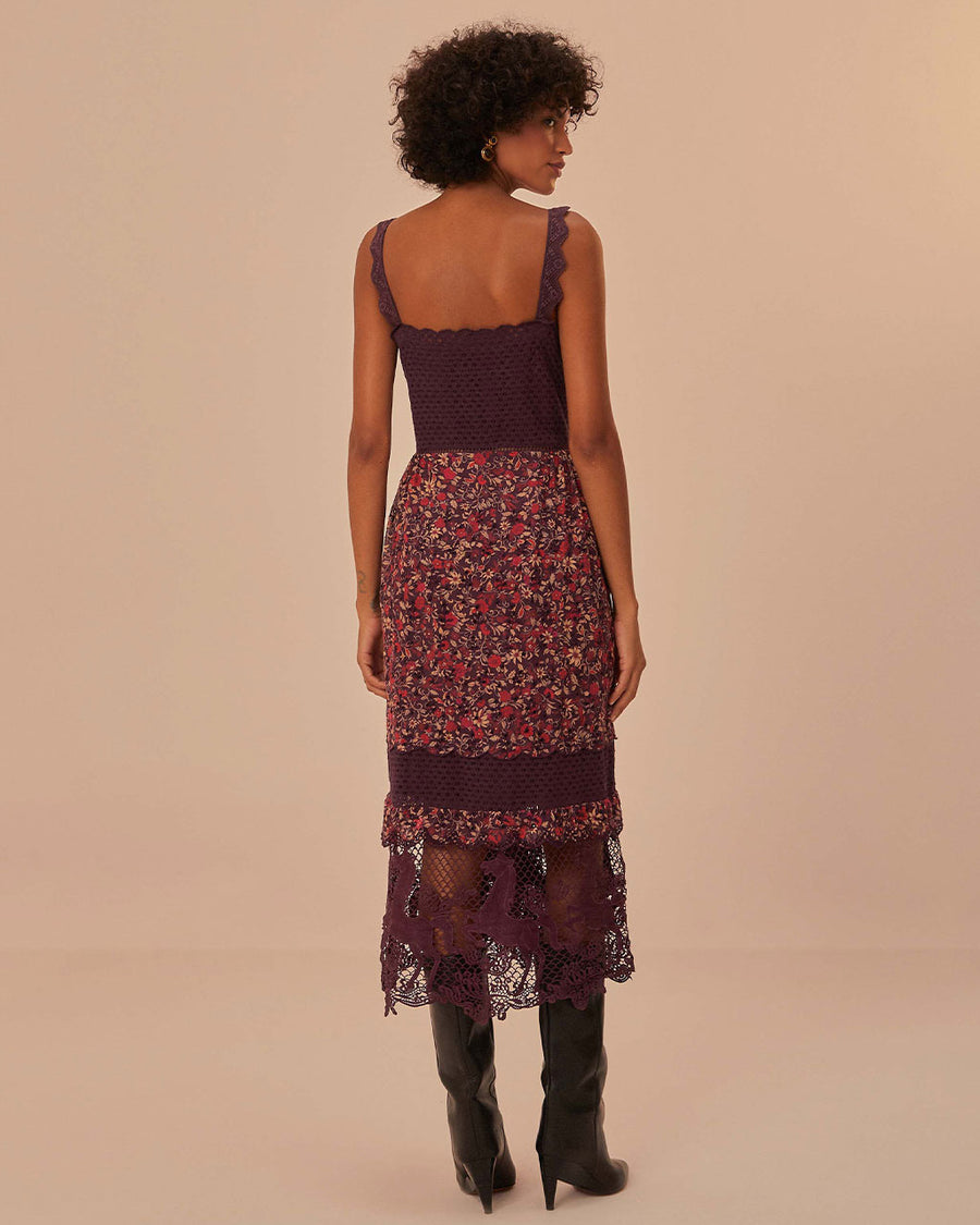 back view of model wearing purple midi dress with crochet bodice and floral skirt with lace and crochet details