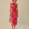 model wearing and pink and red abstract floral midi dress with tank sleeves