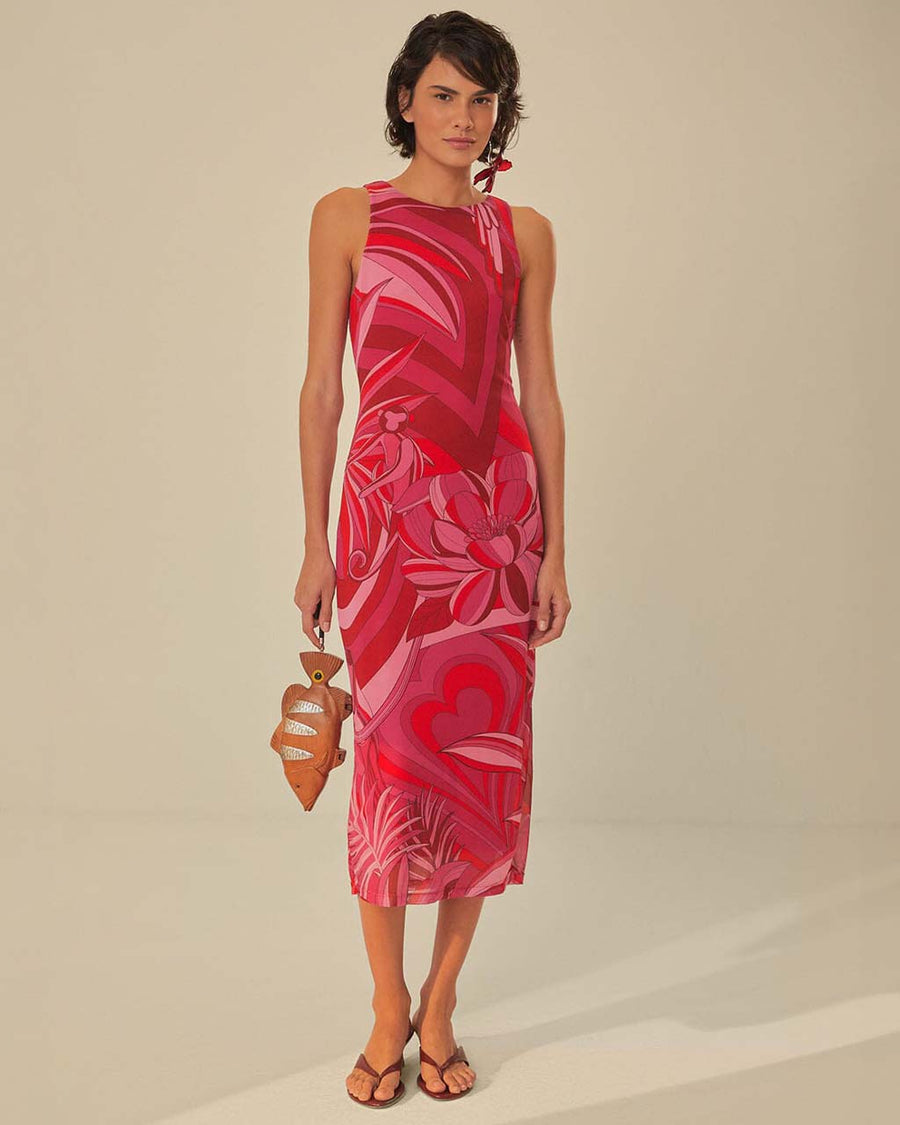 model wearing and pink and red abstract floral midi dress with tank sleeves