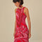 up close of model wearing and pink and red abstract floral midi dress with tank sleeves