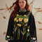 model wearing black relaxed fit sweater with embroidered 'farm rio' and flowers