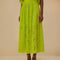 model wearing lime green eyelet maxi skirt with pockets