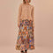 model wearing sand midi skirt with colorful abstract heart and ikat prints