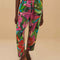 model wearing colorful tropical floral print with beaded tassel tie waist and side pockets