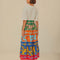 back view of model wearing colorful floral stripe midi skirt with side zipper