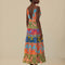 back view of model wearing colorful floral stripe midi dress with deep v and braided straps