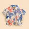 off white short sleeve button down top with blue and red abstract lobster print