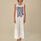 model wearing white wide leg jumpsuit with 'copacabana brasil' graphic on the front