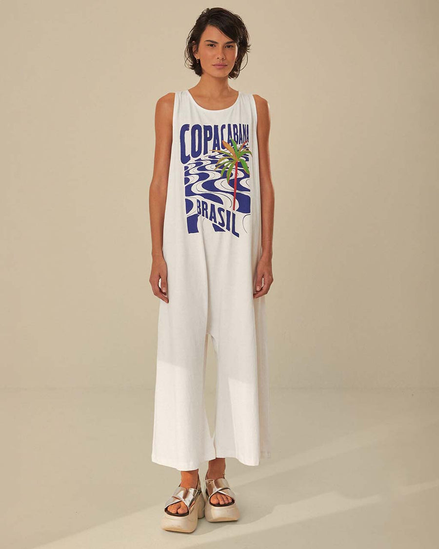 model wearing white wide leg jumpsuit with 'copacabana brasil' graphic on the front