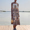 model wearing white midi dress with colorful floral and fan print and tie straps