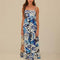 model wearing white maxi dress with blue mantas print