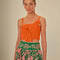 model wearing orange cropped tank with bow front detail on bust 