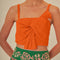 up close of model wearing orange cropped tank with bow front detail on bust