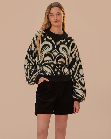 model wearing black and white ikat print sweater