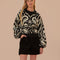 model wearing black and white ikat print sweater