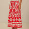 bottom view of model wearing white and red seashell print midi skirt