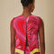 back slit on pink and red abstract floral tank with wavy yellow trim