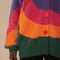 up close of model wearing colorful wavy print oversized cardigan