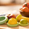 set of 5 various green and yellow green food huggers being used with various fruits and veggies