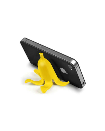 banana shaped phone holder holding up a black phone horizontally