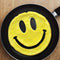 smiley egg in a pan