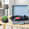 ceramic dark grey milk crate planter  next to a record player