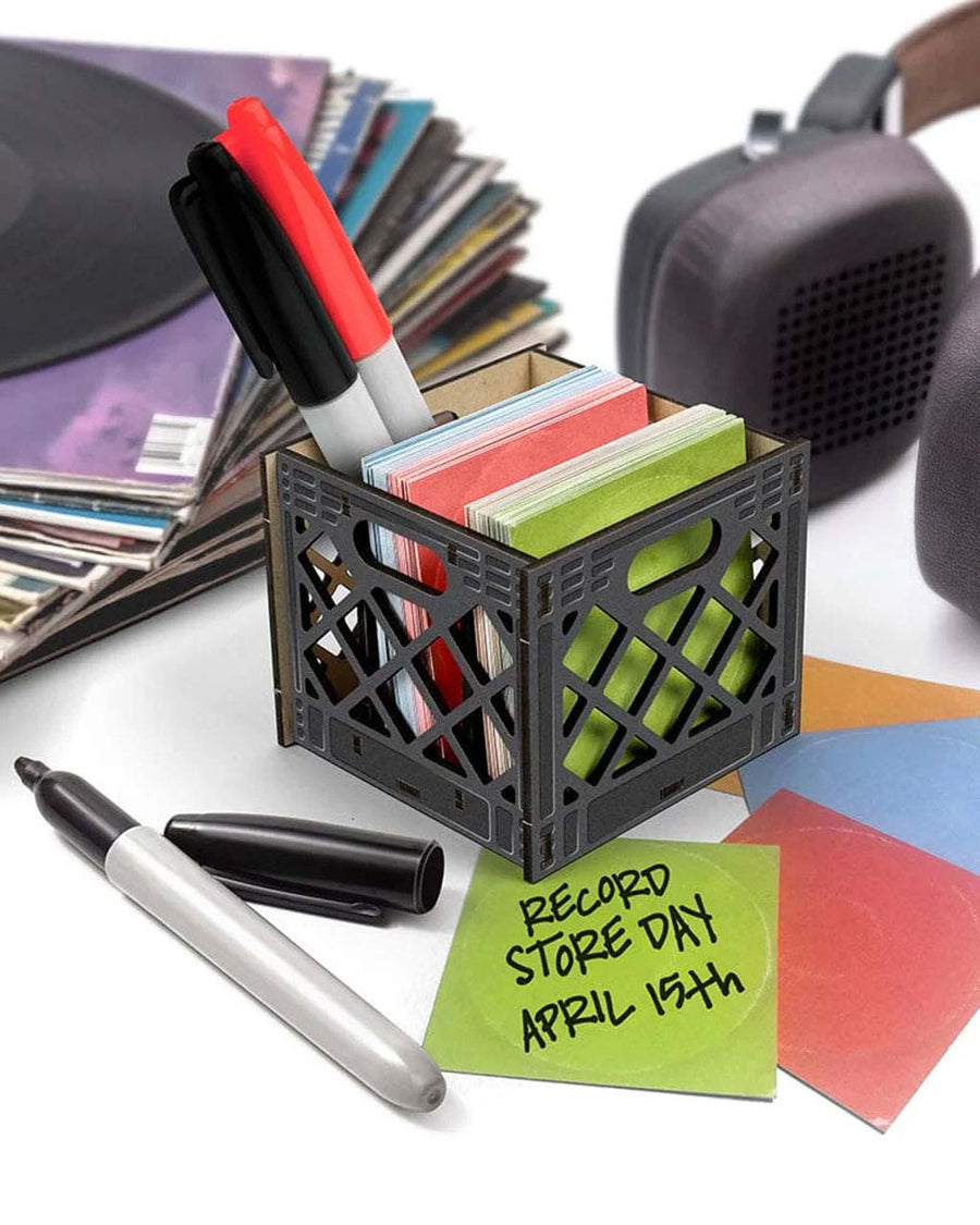 black record crate shaped note card and pencil holder on a desk