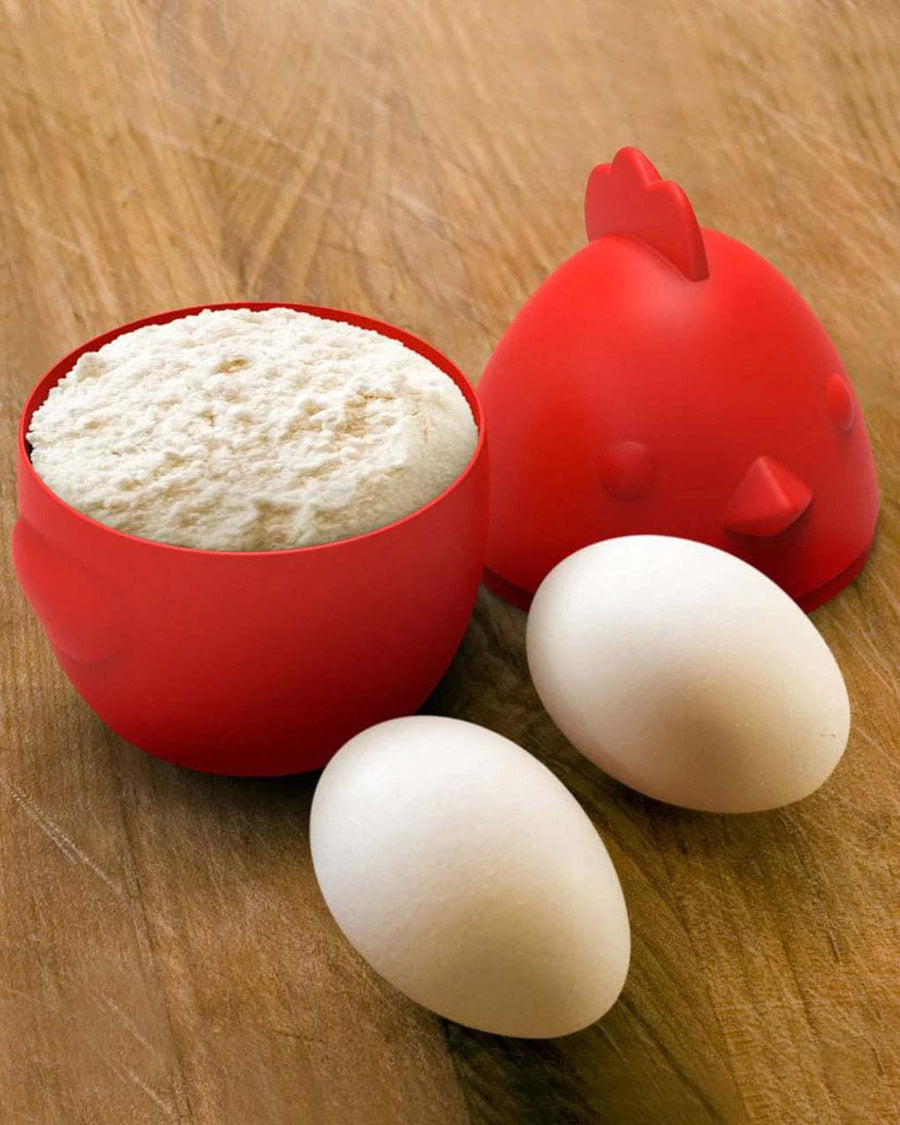 egg and bird shaped nest measuring cups with flour inside