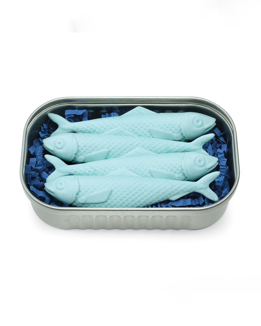 up close of set of 4 blue sardine erasers in a tin