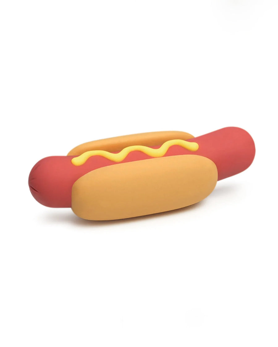 up close of hot dog wine stopper with a squirt of mustard down the center