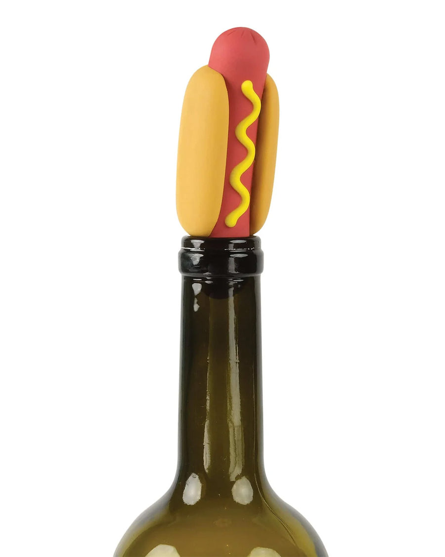 hot dog wine stopper with a squirt of mustard down the center in a wine bottle