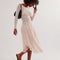 model wearing pretty cream slip lace midi dress with long sleeves and completely sheer lace