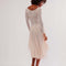 back view of model wearing pretty cream slip lace midi dress with long sleeves and completely sheer lace