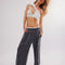 model wearing washed black relaxed fit lounge pants with pockets