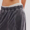 up close of model wearing washed black relaxed fit lounge pants with pockets