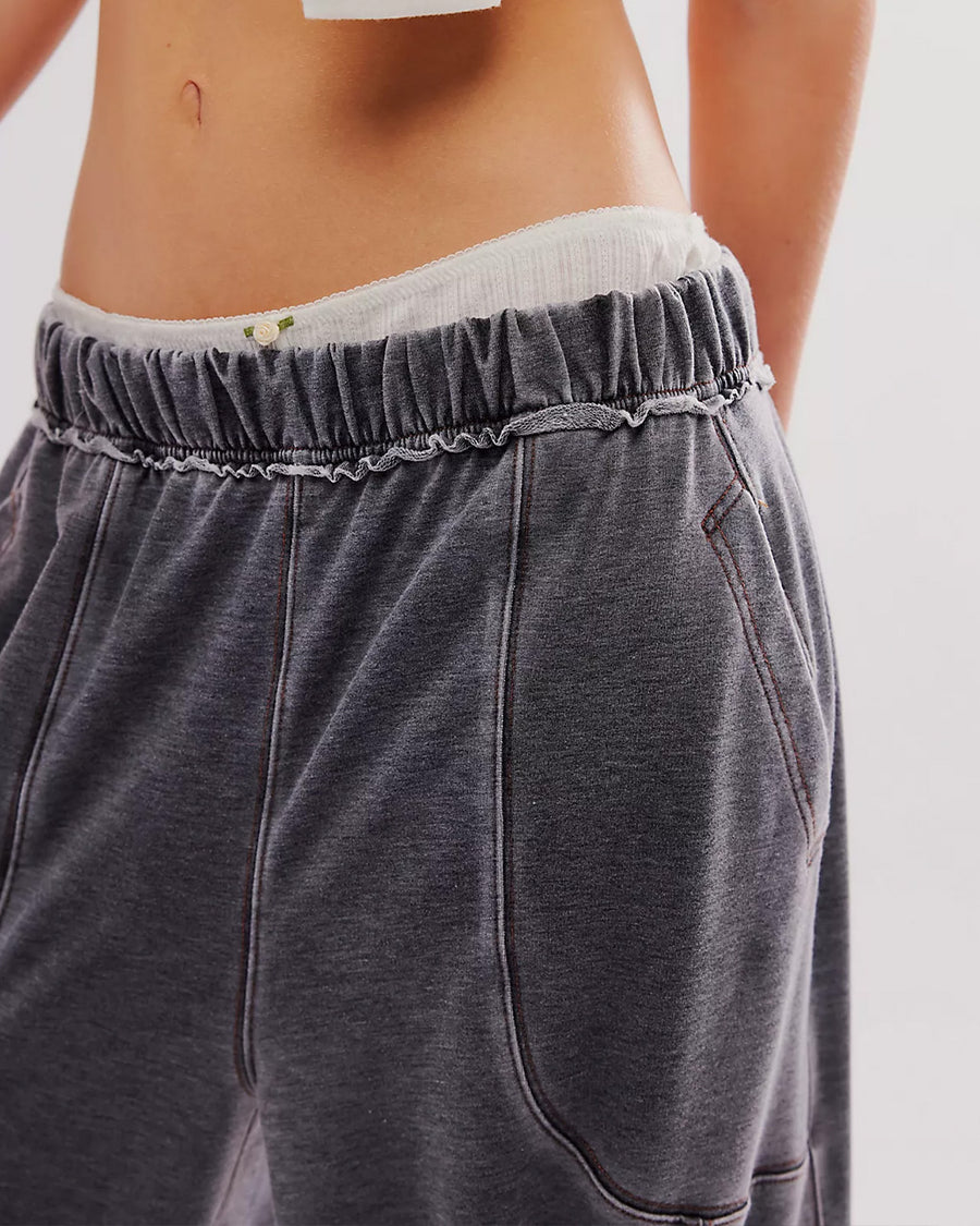 up close of model wearing washed black relaxed fit lounge pants with pockets