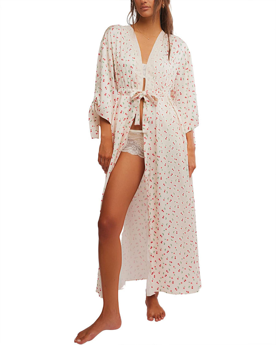 model wearing cream maxi robe with elastic tie waist and red ditsy floral print