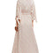 back view of model wearing cream maxi robe with elastic tie waist and red ditsy floral print