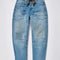 low-rise barrel jeans with slight distressing and denim colored patches