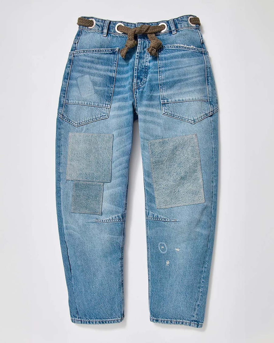 low-rise barrel jeans with slight distressing and denim colored patches