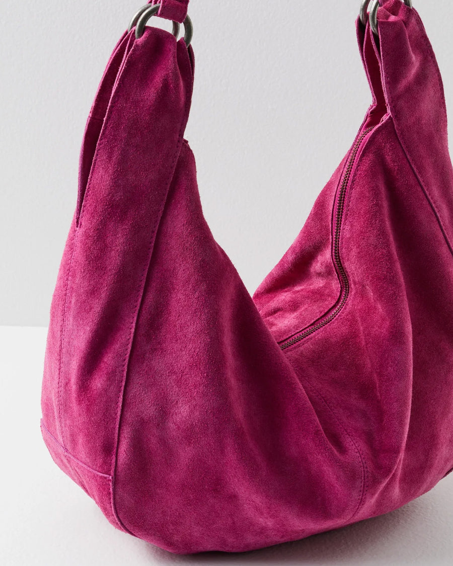 up close of zippered suede fuchsia slouchy tote bag