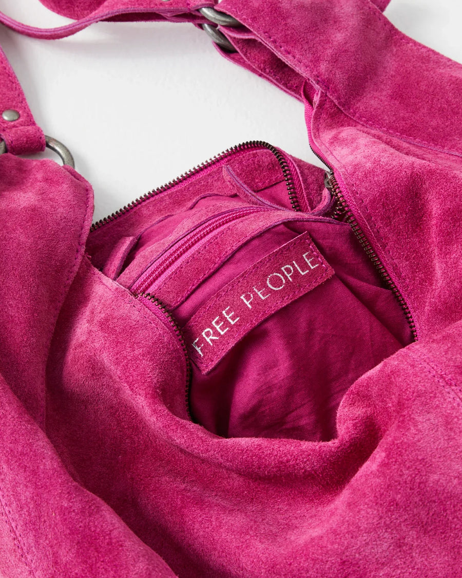 inside label of suede fuchsia slouchy tote bag